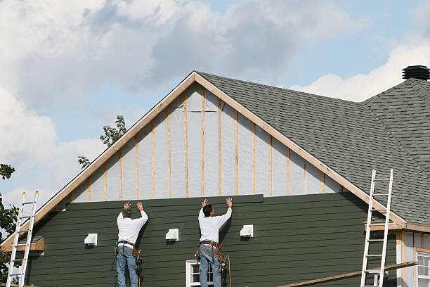 Professional Siding Contractor technician working in Greenvale, NY
